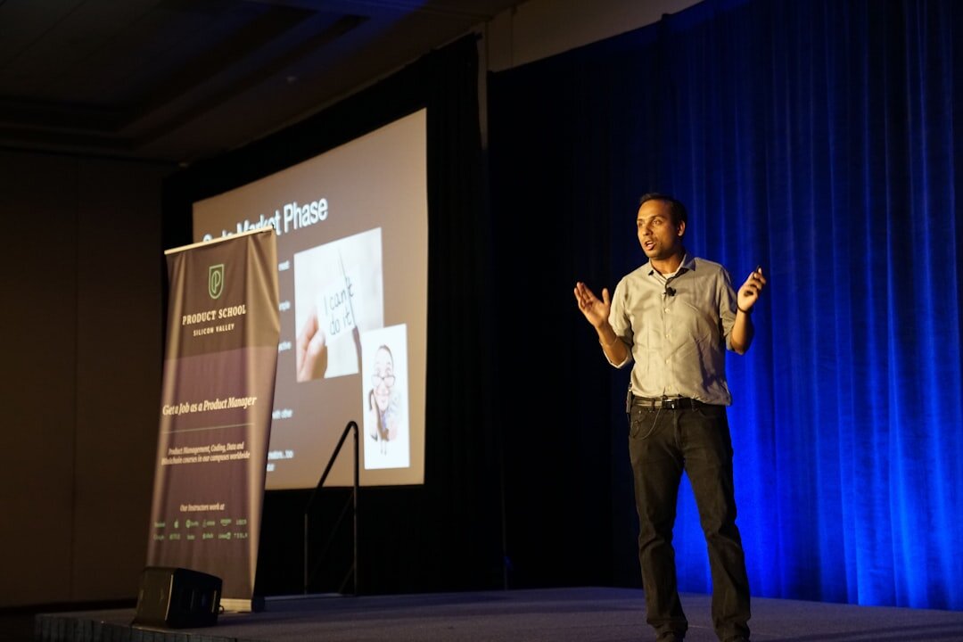 Keynote speaker presenting on stage at a business summit